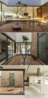 A small interior courtyard features a huge skylight and a sculpture. House Around A Central Courtyard Charged Voids The Architects Diary Modern Small House Design Small House Interior Design Interior Courtyard
