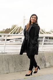 A selection of women's trench coats, all in black. Why My Burberry Trench Coat Is Worth The Money