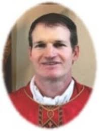 Staff Member: Father Den Irwin