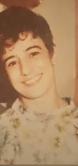 My grandfather Calvin DeFord with his mother outside of her N Chester St.  florist shop and his father loading the delivery car, early 1940s