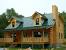 Burnished Slate Metal Roof On Log Cabin