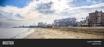 Larnaca finikoudes promenade sea front, cyprus. Finikoudes Sandy Beach Image Photo Free Trial Bigstock