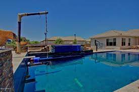 We put the cable clamp inside the holes and slid the rope through the cable clamps. 3357 E Vallejo Ct Gilbert Az 85298 Ziprealty Swimming Pools Backyard Swimming Pool Designs Cool Pools