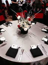Magic Themed Event Complete With A Top Hat Floral Centerpiece On Silver Matte Satin Linens Black Linen Napkins Magic Party Magician Party Casino Centerpieces