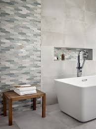 Instead of attempting to tile sloping walls, simply stop part way up and paint the rest white. Express Your Tile Style With Hexagons A Blast From The Past This Traditional Shape Is Reanimated Best Bathroom Tiles Bathroom Tile Designs Amazing Bathrooms