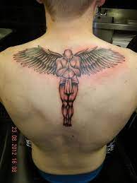 Tattoos of archangels usually have an angel with a light behind them, with open wings and with armor or sword. Angel Tattoo In 2021 Guardian Angel Tattoo Back Tattoos For Guys Angel Tattoo Men