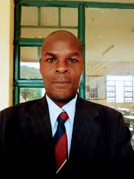 Vice President Michael Usi pays final respects to the late Dr. John Mataya 