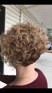 Short Curly Angled Bob With Root Shadow And Blonde Balayage Short Curly Haircuts Curly Bob Hairstyles Short Permed Hair