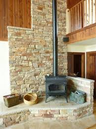 Woodstove Is Beautiful And Functional Elevated On Stone Hearth Can Heat Home Wood Burning Stove Wood Stove Surround Wood Stove