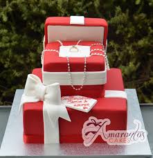 A good number of them are designed with engagement rings with ribbons. Engagement Ring Cakes Designs