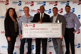 JAKE'S 58 AND SUFFOLK OTB TEAM UP WITH THE SHERIFF'S OFFICE TO SEND LOCAL  CHILDREN TO CAMP Recently, Suffolk County Sheriff Errol Toulon Jr. accepted  a check from Jake's 58 and Suffolk