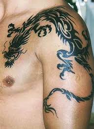 This is a maori tribal tattoo that is dominated by black and bold spirals known as 'koru'. Black Chinese Tribal Dragon Tattoo On Left Upper Chest And Arm