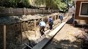 Compact the base material, making a minimum of two passes with a plate compactor. How To Build A Concrete Retaining Wall 2020 All Access Construction