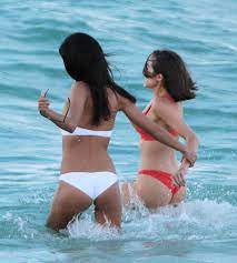 Model Olivia Culpo flashes her bum in a thong bikini as she splashes in the  sea with Victoria's Secret star Shanina Shaik | The Irish Sun
