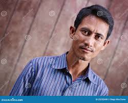 Portrait of Mid Adult Asian Man Looking at Camera Stock Image