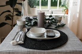 Dining table set up and set up with a lot of elegance in the dining room of a restaurant or the dining room of a very rich house,. Dining Set Up Stock Photos Offset