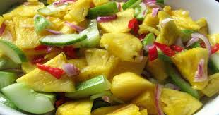 Enchi kebin, deep fried chicken pieces marinated in a paste of coconut milk and rempah (spices). Acar Timun Dan Nenas Trancam Kuali Sudip