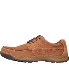 A hush puppies shoe on a man's foot. Hush Puppies Herren Tucker Schuhe Braun