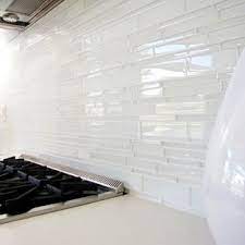 I want to use these glass tiles 3x6 or 4x12 installed in a vertical design on my bathroom walls (not in the shower). Houzz Tour A Labor Of Modern Love In Costa Mesa Midcentury Kitchen Orange County Glass Backsplash Kitchen Glass Tile Backsplash Kitchen White Glass Tile