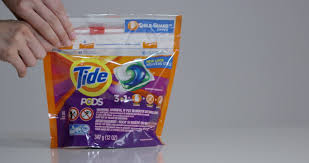 There are increasing reports that tide pods are leaving stains on laundry; Tide Pod Bag Hands Stock Footage Video 100 Royalty Free 1006744213 Shutterstock