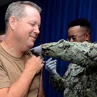 Gas Turbine System Mechanic 1st Class Eric McCartney assigned to USS  Ingraham (FFG 61) meets his new five day old daughter upon returning from  deployment.