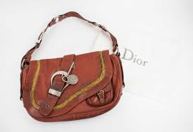 Patricia nash barcelona leather camel saddle crossbody buckle bag purse. Christian Dior Gaucho Saddle Bag Burgundy Leather With Aged Silver Tone Hardware Front Flap Closure With Buckle Small Front Pocket Adjustable Shoulder Strap Monogram Lining With Receipt And Dust Bag 36cm X