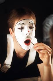 AMN T.A. Burrows from Lackland Air Force Base, Texas, applies make-up prior  to performing a mime act in the Air Force Talent Contest