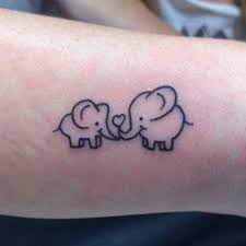 Black and grey baby elephant with flower tattoo on left back shoulder. 75 Best Elephant Tattoo Designs For Women 2021 Guide