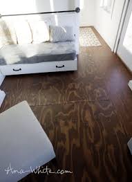 Flooring Can Be So Expensive But It Doesn T Have To Be These Incredibly Creative Floor Transformations Cheap Flooring Stained Plywood Floors Plywood Flooring