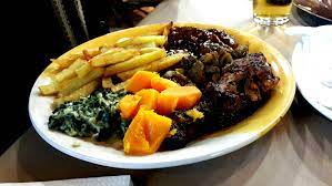 Dinner (shisanyama / braai / bbq style) at a local soweto restaurant. Tavern Restaurant In Soweto Eatout