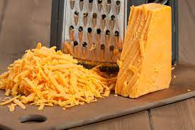 Shredded cheese is usually made of cheddar, edam, or mozzarella cheese. You Ve Been Grating Cheese Wrong Your Entire Life Kitchn