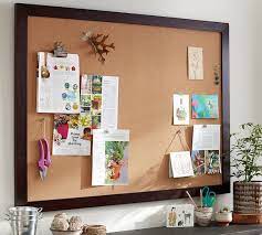 I did find some really nicely done cork boards that i considered (shop around below), but once i had the idea in my head of turning the whole wall into a cork board wall i couldn't stop. Wooden Framed Corkboard Pottery Barn