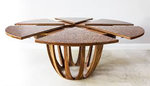 Magnum is a coffee table convertible into a dining table. Johnson Furniture