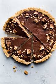 Snickers Caramel Tart With Salted Caramel Peanut Crust Salty Peanuts And Chocolate Peanut Butter Topping Recipe On Sally Desserts Caramel Tart Tart Recipes