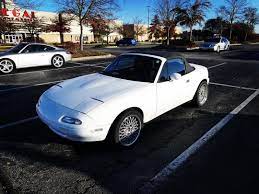 Clean Little Mazda Miata White Aftermarket Wheels Convertible Love The Pop Up Headlights Just A Classic Mazda Mazda Miata Miata Mazda