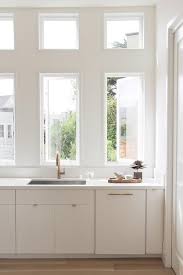 White Flat Front Cabinets With Gold Hardware Transitional Kitchen White Paneling White Modern Kitchen Flat Panel Cabinets