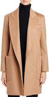 It's made from soft camel hair with a plush handle and has a loose fit that's perfect for layering over a chunky sweater. Pin On Max Mara