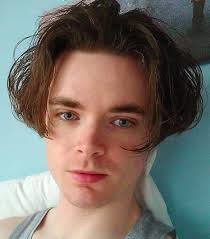 This hairstyle is characterized by short hair that is partitioned to the right or the left, based on your choice. Middle Part Hair Male Novocom Top