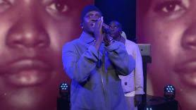 Jim James performs with The Roots