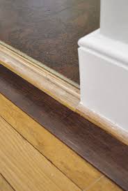 This is the top choice for wood and laminate flooring transitions to another hard surface. How To Add Floor Trim Transitions And Reducers Young House Love