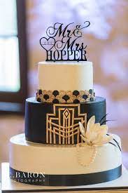 For even more roaring 20's party ideas, follow our gatsby party planning challenge (here) , and get all the party planning details (including decor, food and drinks) you need to throw the best party ever! Gatsby Wedding Cake Stonebridge Houston Wedding Venue Reception Hall Gatsby Themed Gatsby Wedding Theme 1920s Wedding Cake Themed Wedding Cakes