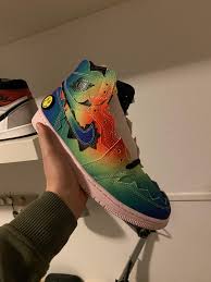 The instagram teaser reveals a wild multicolor upper design, exposed sponge on the tongue, and a lightening eyed smiley face on the heel. Air Jordan 1 High J Balvin Sneakers