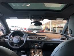 View Of The Cockpit And Moonroof From Rear Seats On The 2018 Audi A7 With Black Interior Leather Standard Vehicle Avail Audi Dealership Audi Used Luxury Cars