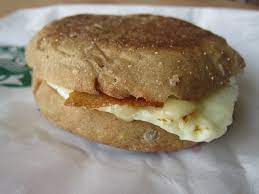 Instead, try the turkey bacon, cheddar, & egg white sandwich, which only contains 230 calories and 2.5 grams of saturated fat. Review Starbucks Reduced Fat Turkey Bacon White Cheddar Classic Breakfast Sandwich Brand Eating