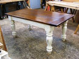 Rectangle Brown Wooden Dining Table With Legs Added By White Leather Dining Chairs On Wooden Fl Rustic Farmhouse Table Farmhouse Dining Unique Farmhouse Tables