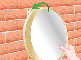 If the wall has no nails, first thing is to rectify that immediately. 3 Simple Ways To Hang A Mirror On A Wall Without Nails Wikihow