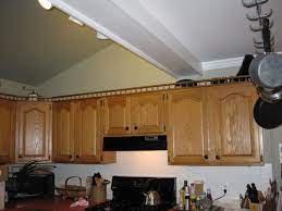 Crown moulding for uneven height cabinets. Height Of Uppers In Small Kitchen With Vaulted Ceiling Opinions