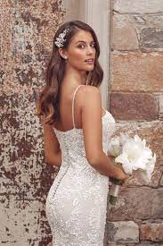 This wedding dress with detachable tulle train and with long off the shoulder sleeves is created for bride who loves fashion style. Vintage Lace Wedding Dresses Justin Alexander