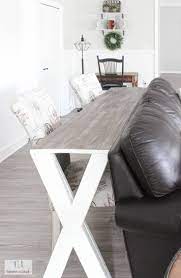 This can work if you have an open floor plan and the sofa divides the kitchen area from the rest of the social space. Diy X Sofa Table From Scrap Wood Sofa Dining Table Sofa Table Diy Sofa Table