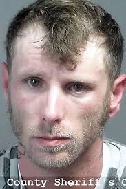 Man arrested after allegedly having drugs, loaded gun in vehicle